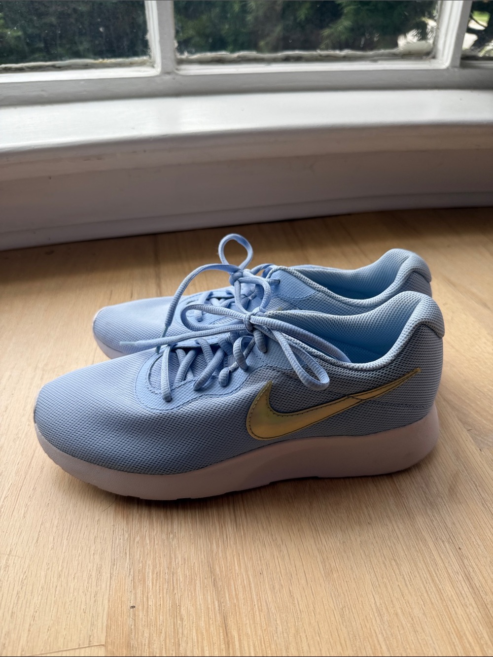 Nike Women’s Light Blue Athletic Sneakers with Hologram Swoosh